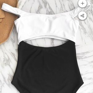 One piece bathing suit with sexy cut out.